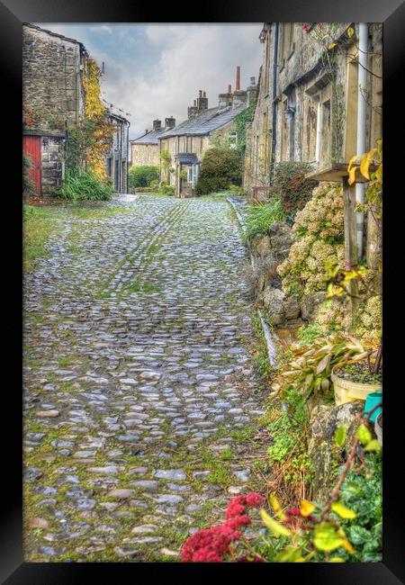 Grassington cobbled street. Framed Print by David Birchall