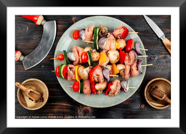 Raw kebab from meat, meat skewers. Framed Mounted Print by Mykola Lunov Mykola