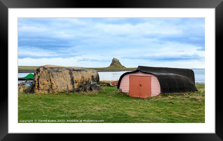 Lindisfarne Huts and Castle Framed Mounted Print by Darrell Evans