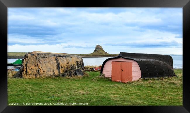Lindisfarne Huts and Castle Framed Print by Darrell Evans