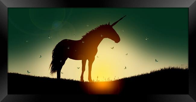 Silhouette of unicorn at sunset surrounded by fairy butterflies Framed Print by Guido Parmiggiani