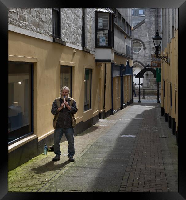 Flautist busking on the streets of Galway Framed Print by Rory Trappe