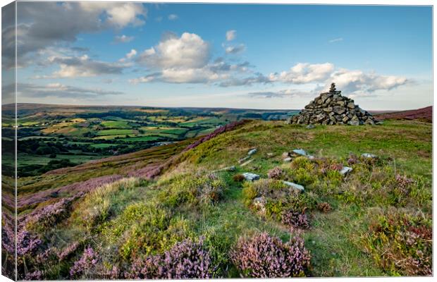 Pile of stones looking over Rosedale Abbey, North  Canvas Print by Martin Williams