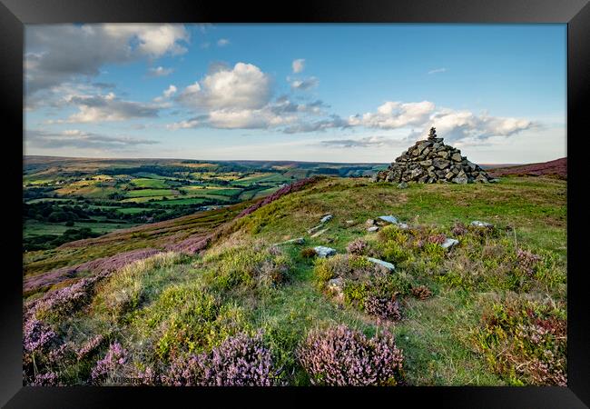 Pile of stones looking over Rosedale Abbey, North  Framed Print by Martin Williams