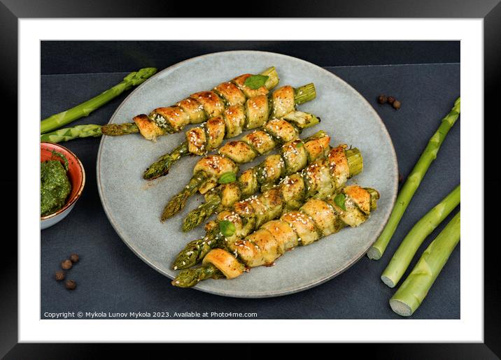 Green asparagus baked in dough. Framed Mounted Print by Mykola Lunov Mykola