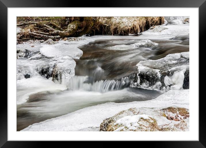 A flowing stream under snowy conditions  Framed Mounted Print by Nick Jenkins