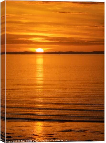 The sun setting over the Welsh coast Canvas Print by Rory Hailes