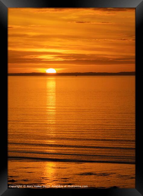 The sun setting over the Welsh coast Framed Print by Rory Hailes