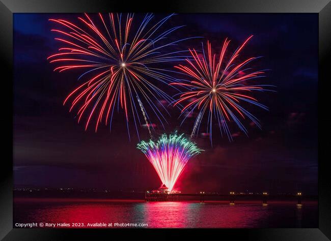 Fire works off the Pier with multiple colours Framed Print by Rory Hailes