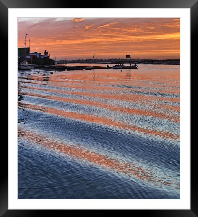 Sunrise reflections over er the passing wakes at Brightlingsea Harbour Framed Mounted Print by Tony lopez