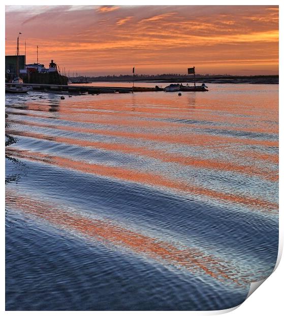 Sunrise reflections over er the passing wakes at Brightlingsea Harbour Print by Tony lopez