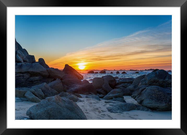 Sunset over rocks on the beach at Meneham Framed Mounted Print by Helen Hotson