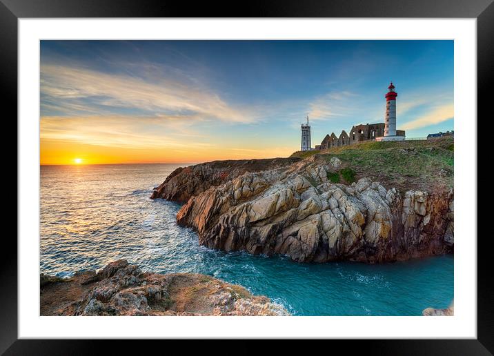 Sunset over the lighthouse at Pointe Saint Mathieu Framed Mounted Print by Helen Hotson