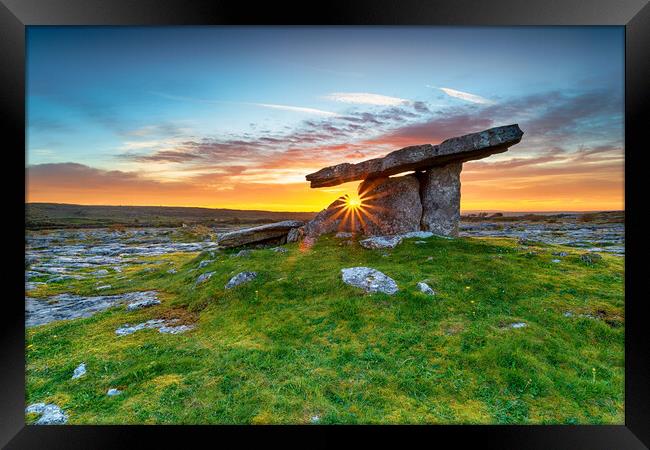 Sunset over Poulnabrone dolmen an ancient portal tomb in the Bur Framed Print by Helen Hotson