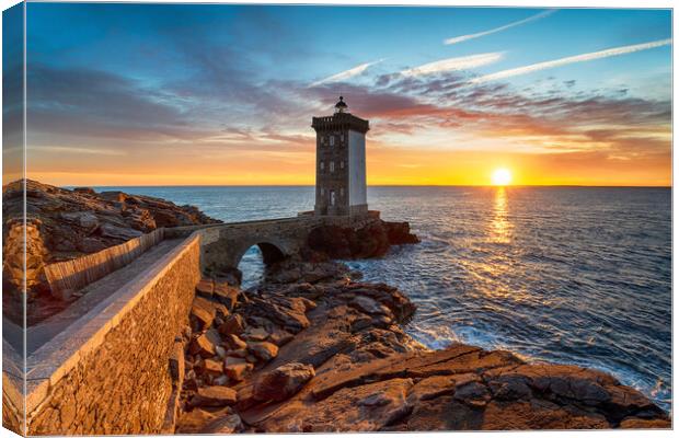 Sunset over the Lighthouse at Kermorvan Canvas Print by Helen Hotson
