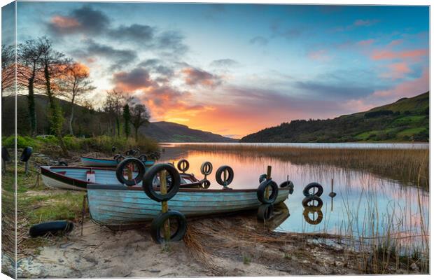 Beautiful sunrise over boats at Glencar Lough Canvas Print by Helen Hotson