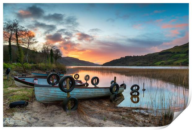 Beautiful sunrise over boats at Glencar Lough Print by Helen Hotson