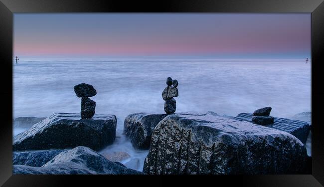 Stone Stack in the sea Framed Print by robert walkley