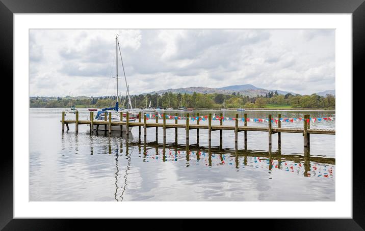 Red and white bunting reflects in Lake Windermere Framed Mounted Print by Jason Wells