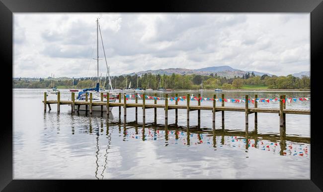 Red and white bunting reflects in Lake Windermere Framed Print by Jason Wells
