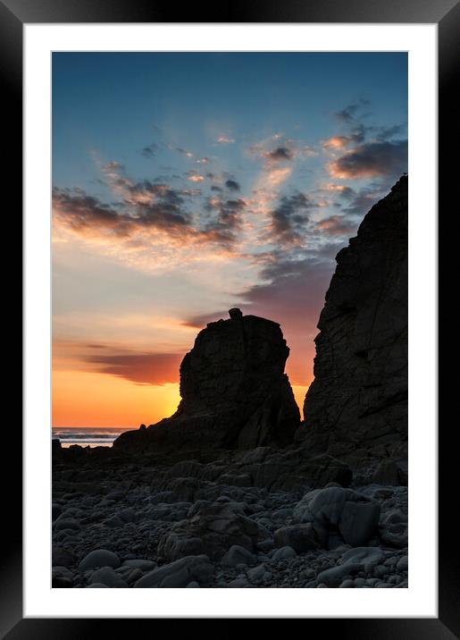 Sun Setting behind a Rock Stack Framed Mounted Print by Kevin Howchin