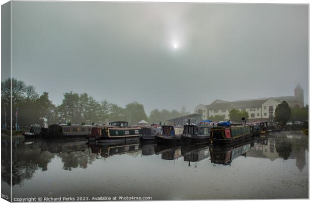 Misty morning on the Leeds - Liverpool canal Canvas Print by Richard Perks