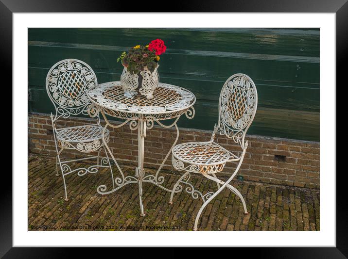 Old table and chairs in Zaanse Schans Framed Mounted Print by Veronika Druzhnieva