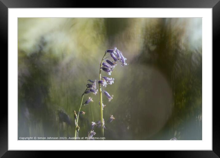 A blurry image of a flower Framed Mounted Print by Simon Johnson