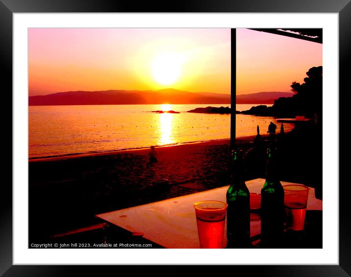 Basking in the Fiery Glory of Agia Eleni Beach Sun Framed Mounted Print by john hill