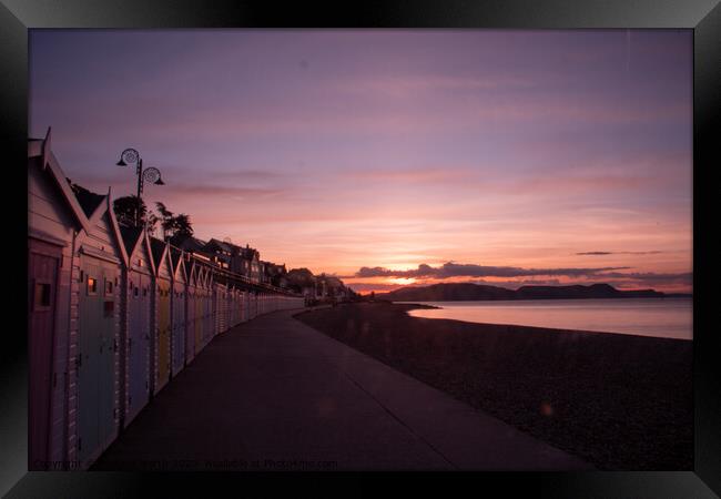 Beach hut sunrise at Lyme Regis Framed Print by Richard North