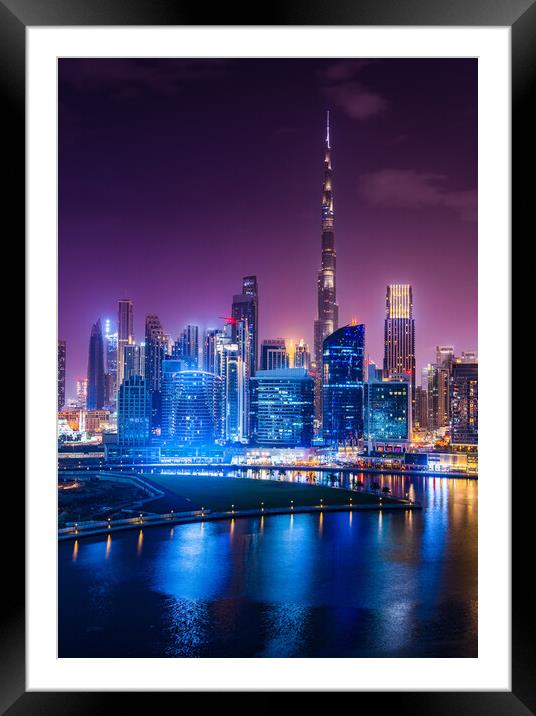 Glowing Dubai Skyline at Night Framed Mounted Print by Steve Heap