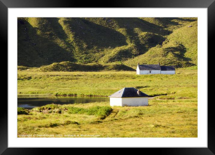 Huts by the Lake Framed Mounted Print by Darrell Evans