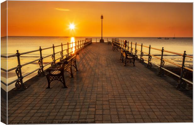 Sunrise at the Banjo Jetty in Swanage Canvas Print by Ian Middleton