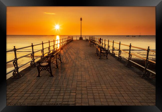 Sunrise at the Banjo Jetty in Swanage Framed Print by Ian Middleton