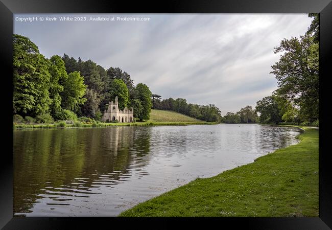 Vineyard and old ruin on the banks of Painshill Park lake Framed Print by Kevin White