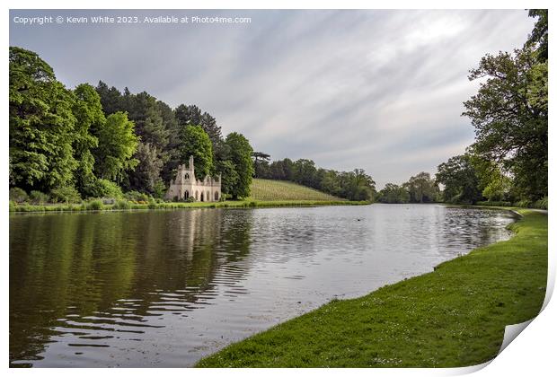 Vineyard and old ruin on the banks of Painshill Park lake Print by Kevin White