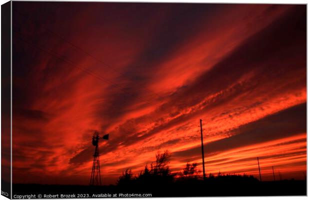 Kansas Blazing Red Sunset with a Windmill Silhouette Canvas Print by Robert Brozek