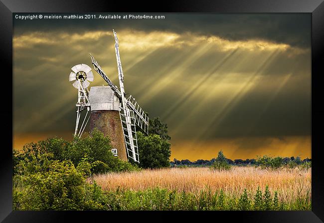 windmill with sunbeams Framed Print by meirion matthias