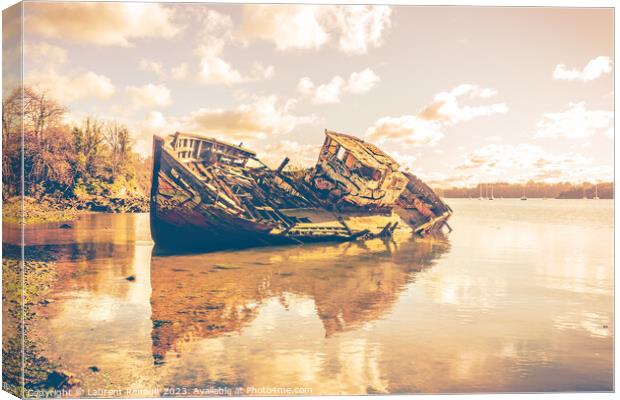 Wreck of a wooden fishing boat abandoned on the shore Canvas Print by Laurent Renault