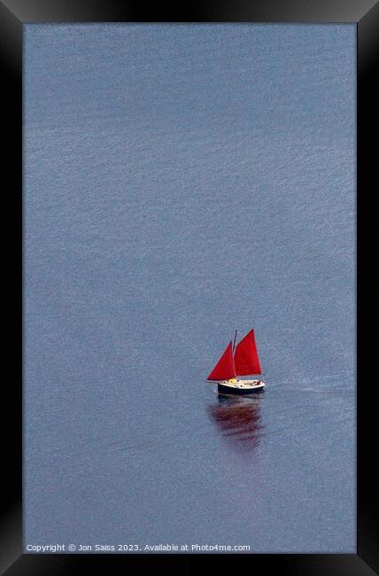 boat with red sails Framed Print by Jon Saiss