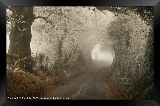 Cold and misty road Framed Print by Jon Saiss