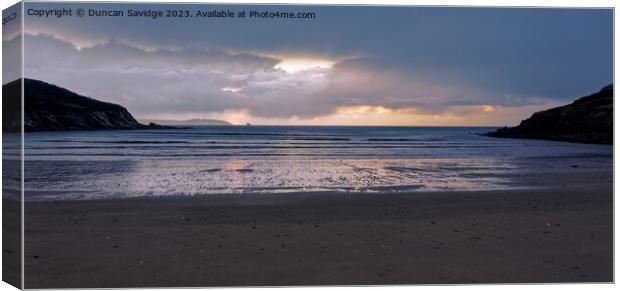 Moody sunrise at Maenporth beach Cornwall Canvas Print by Duncan Savidge