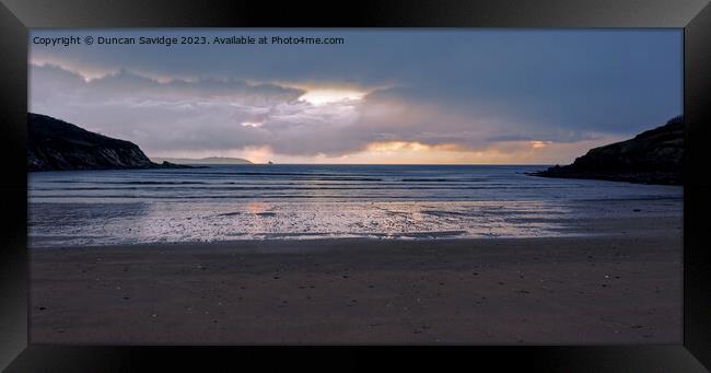 Moody sunrise at Maenporth beach Cornwall Framed Print by Duncan Savidge