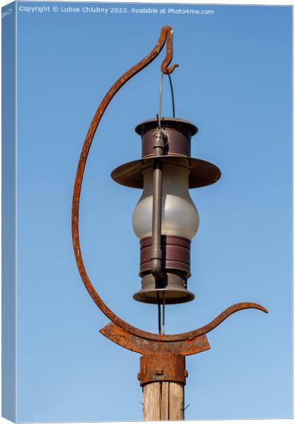 Outdoor lighting in the shape of a kerosene lamp Canvas Print by Lubos Chlubny