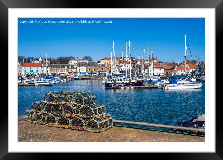 Creels on quayside of Anstruther harbour Framed Mounted Print by Angus McComiskey