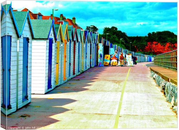 Vibrant Beach Huts on Paignton Shore Canvas Print by john hill
