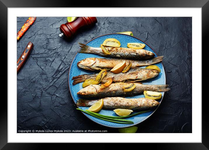 Fried whole fish with kiwi and lime. Framed Mounted Print by Mykola Lunov Mykola
