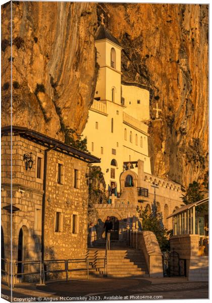 Upper church of Ostrog Monastery in Montenegro Canvas Print by Angus McComiskey