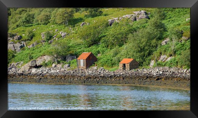 Shacks at the waters edge Framed Print by Darrell Evans