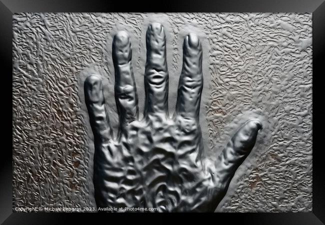 Metal surface background with the relief imprint of a human hand Framed Print by Michael Piepgras
